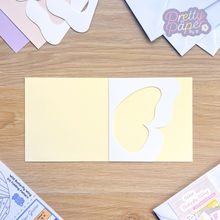 Load image into Gallery viewer, butterfly wing aperture on pale yellow card blank