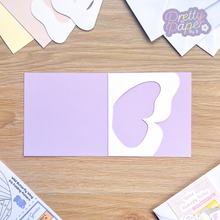 Load image into Gallery viewer, butterfly wing aperture on lilac card blank