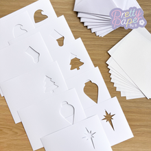 Load image into Gallery viewer, Ten card apertures, inserts and envelopes: Two hats, two stockings, two trees, two baubles, two stars