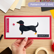 Load image into Gallery viewer, Dachshund Iris Folding Pattern made into a black & tan dog on a red card blank.
