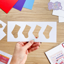 Load image into Gallery viewer, four stockings in a card aperture