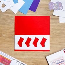 Load image into Gallery viewer, four stocking aperture on red card