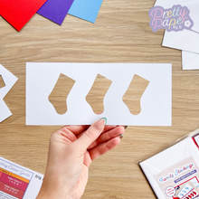 Load image into Gallery viewer, three stockings in a card aperture