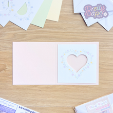 Load image into Gallery viewer, Floral heart aperture on blush pink card