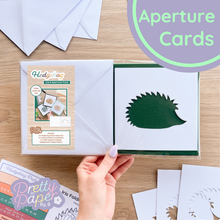 Load image into Gallery viewer, Hedgehog Aperture Card (Pack of 3) | 3 x Apertures, Coloured Card Blanks & White Envelopes | Woodland Christmas