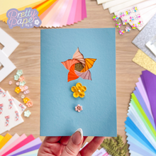 Load image into Gallery viewer, Orange iris fold lily on blue card