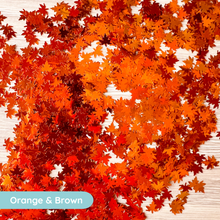 Load image into Gallery viewer, Autumn-themed confetti with orange and brown colors on a wooden surface.