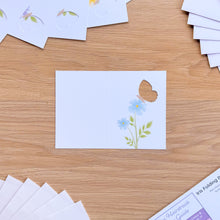 Load image into Gallery viewer, A mini butterfly card aperture with printed blue flowers