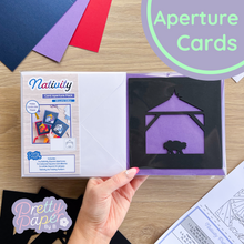Load image into Gallery viewer, Nativity Silhouette Aperture Card Pack makes three iris folding cards featuring a baby Jesus crib
