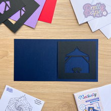 Load image into Gallery viewer, black nativity aperture on navy blue card