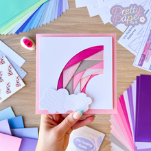 Load image into Gallery viewer, An iris folding pink rainbow curve with two white card clouds

