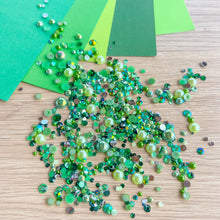 Load image into Gallery viewer, Green pearl gem mix and paper on a wooden surface