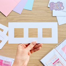 Load image into Gallery viewer, white card with three square apertures