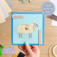 Load image into Gallery viewer, cream iris fold sheep on blue card