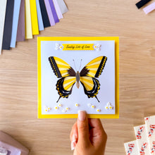 Load image into Gallery viewer, Iris folded swallowtail butterfly greeting card embellished with white daisy resin flowers and leaves and 'ending lots of love' text