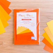Load image into Gallery viewer, Pack of orange and yellow paper sheets on a wooden surface