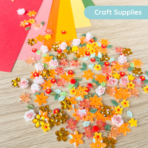 Colourful flower and leaf-shaped craft supplies on a wooden surface with 'Craft Supplies' label.