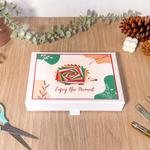 Load image into Gallery viewer, Decorative box with hedgehog design and 'Enjoy the Moment' text on a wooden surface with decorative elements.
