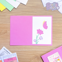 Load image into Gallery viewer, Butterfly and flower aperture on pink card blank
