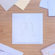Load image into Gallery viewer, A cut-out of two champagne glasses on  a white card blank 

