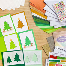 Load image into Gallery viewer, Six coloured card blanks and apertures alongside coloured paper, envelopes, adhesive gems, glitter card, instruction booklet and iris folding patterns and colour guides
