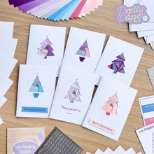 Load image into Gallery viewer, Six iris fold christmas tree cards made with the  frozen forest kit
