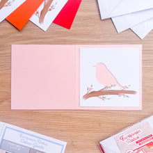 Load image into Gallery viewer, robin aperture on pink card blank
