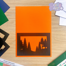 Load image into Gallery viewer, Forest Aperture on orange card

