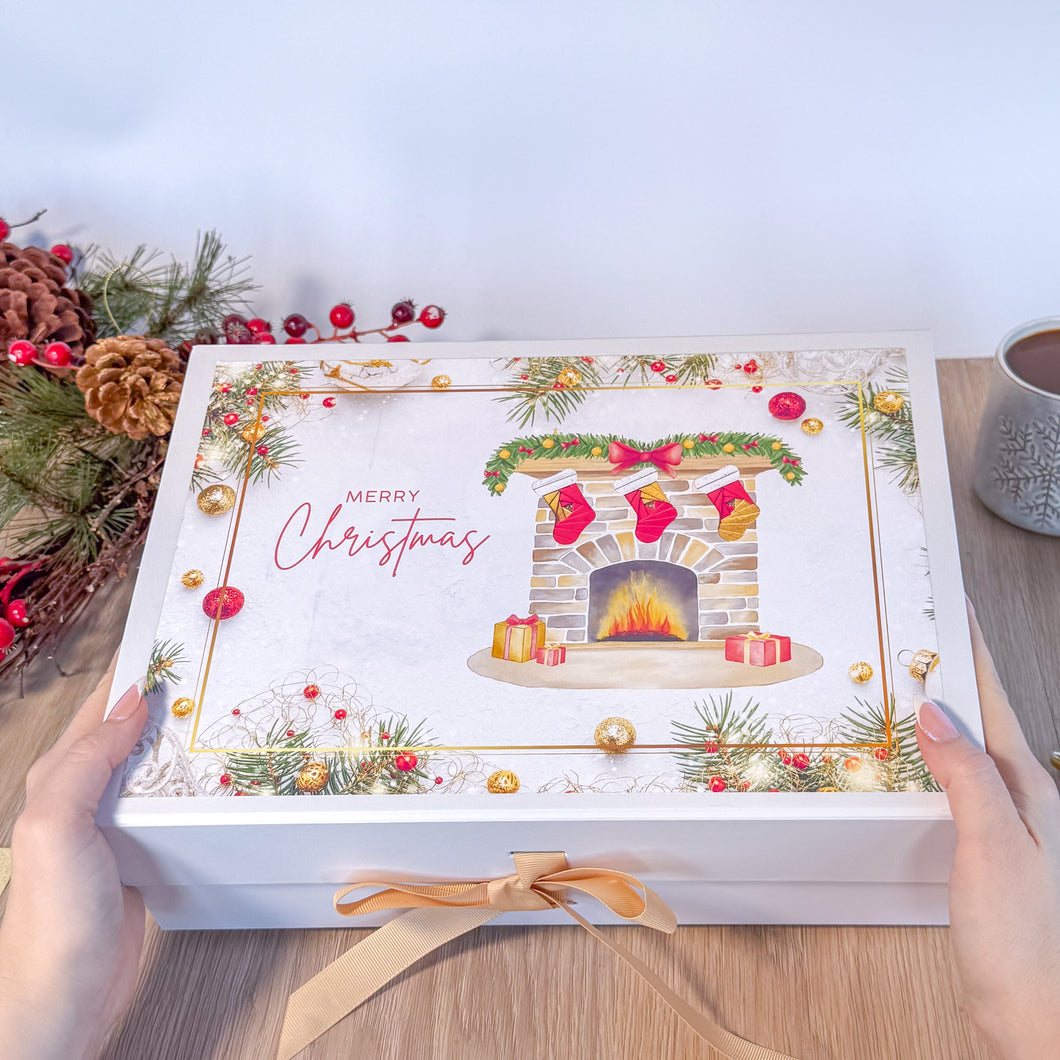 Decorative Christmas gift box with festive design on a wooden surface.