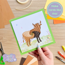Load image into Gallery viewer, Brown iris fold highland cow on green card with pink and white meadow embellishment

