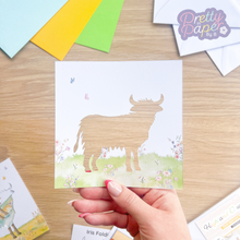 Load image into Gallery viewer, Highland Cow Card Aperture with pink and white meadow embellishment
