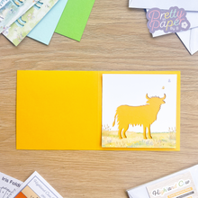 Load image into Gallery viewer, Highland Cow Card Aperture on buttercup card blank
