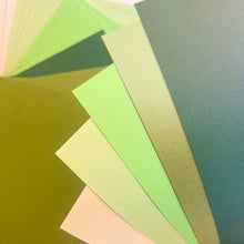 Load image into Gallery viewer, Collection of green paper sheets with different shades.
