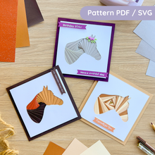 Load image into Gallery viewer, Three horse profile iris folding cards. One made with three brown papers in a traditional iris fold spiral. One made with brown and cream papers in an alternating striped effect. One made in a single colour grey spiral.
