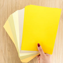 Load image into Gallery viewer, Thirty sheets of A5 paper in 5 different yellow/gold/cream shades
