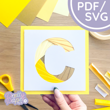 Load image into Gallery viewer, Alphabet letter C in yellow papers folded to create a spiral effect.
