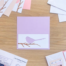 Load image into Gallery viewer, long-tailed tit cut-out on scored lilac card blank
