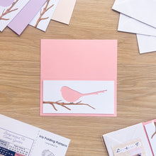 Load image into Gallery viewer, Long-tailed tit aperture cut-out on pink card blank

