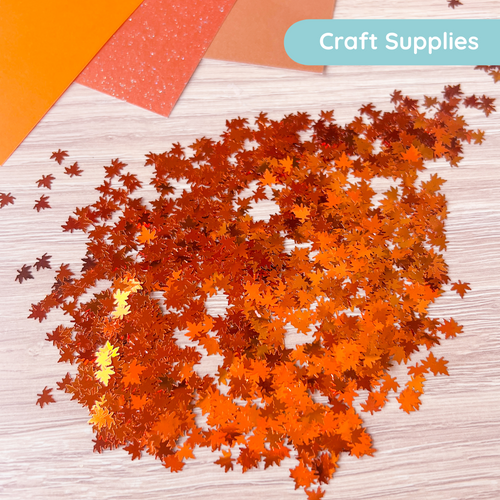 Orange craft supplies with 'Craft Supplies' label on a wooden surface