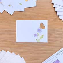 Load image into Gallery viewer, A mini butterfly card aperture with printed purple flowers
