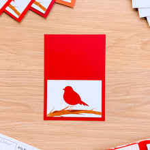 Load image into Gallery viewer, Mini robin aperture on a bright red card blank
