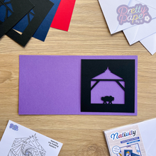 Load image into Gallery viewer, Nativity Silhouette in black on purple card
