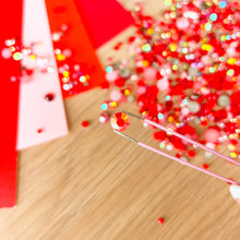 Load image into Gallery viewer, close up of tweezers holding a red crystal
