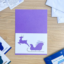 Load image into Gallery viewer, Santa&#39;s Sleigh with Reindeer Aperture Card (Pack of 3) | 3 x Square PRINTED Christmas Apertures, Coloured Card Blanks &amp; White Envelopes | Night Sky Edition | Blue Purple Teal
