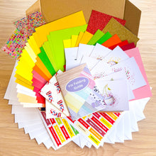 Load image into Gallery viewer, Kit contents arranged in a brown box on a wooden table
