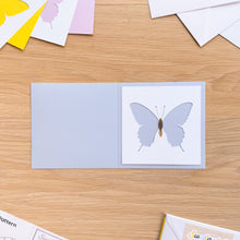 Load image into Gallery viewer, Swallowtail butterfly cut-out aperture on blue card blank
