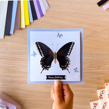 Load image into Gallery viewer, Iris fold swallowtail butterfly greeting card with blue resin butterfly embellishments and 'Happy birthday' greeting

