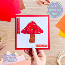 Load image into Gallery viewer, iris fold toadstool on red card
