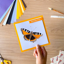 Load image into Gallery viewer, An example of an iris fold butterfly greeting card made with the aperture and card blank and embellished with  'Birthday wishes' text

