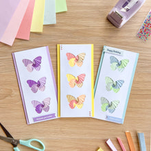 Load image into Gallery viewer, Three triple butterfly iris folding cards made with the triple butterfly aperture pack
